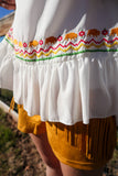 Kiss My Grits Embroidered Flounce Hem Top Ivory